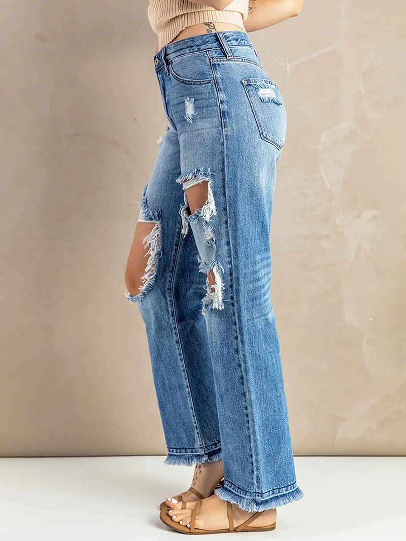 Women's washed ripped fringed jeans