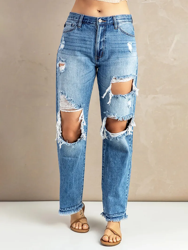 Women's washed ripped fringed jeans