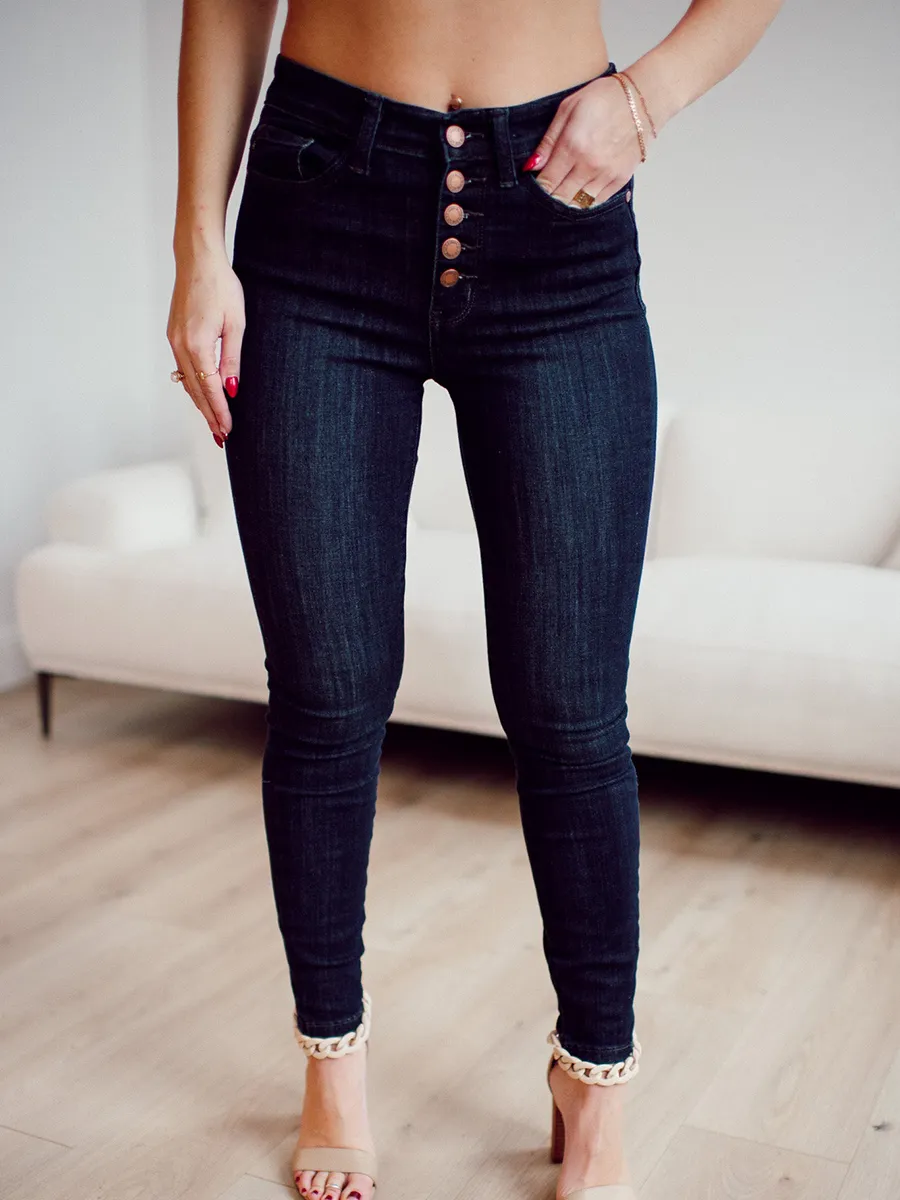 Dark blue high waisted metal button skinny jeans